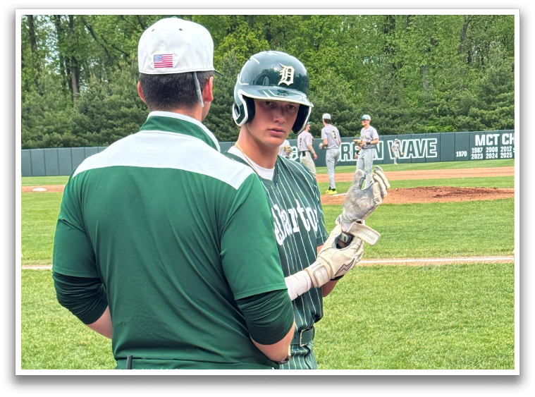 A baseball player holding a bat. Description generated by AI