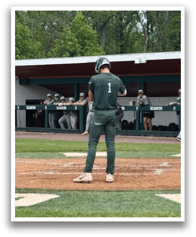 A baseball player is standing at home plate. Description generated by AI