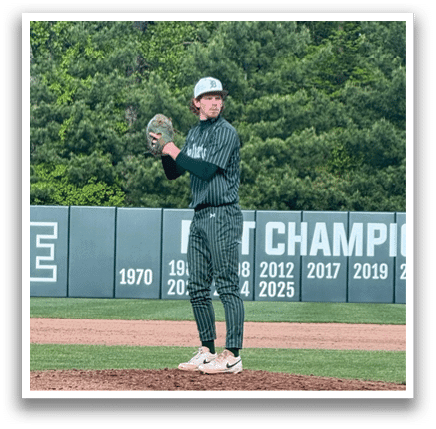 A baseball pitcher on the mound. Description generated by AI