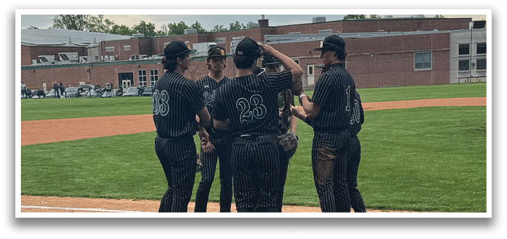 A group of people standing on a baseball field. Description generated by AI