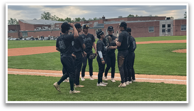 A group of people standing on a baseball field. Description generated by AI