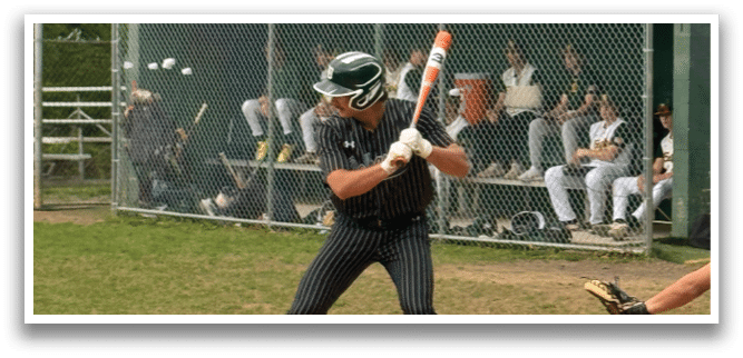 A baseball player is swinging a bat at a ball. Description generated by AI