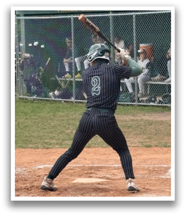 A baseball player is swinging a bat on a field. Description generated by AI