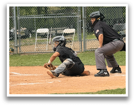 A baseball player is sliding into home plate. Description generated by AI