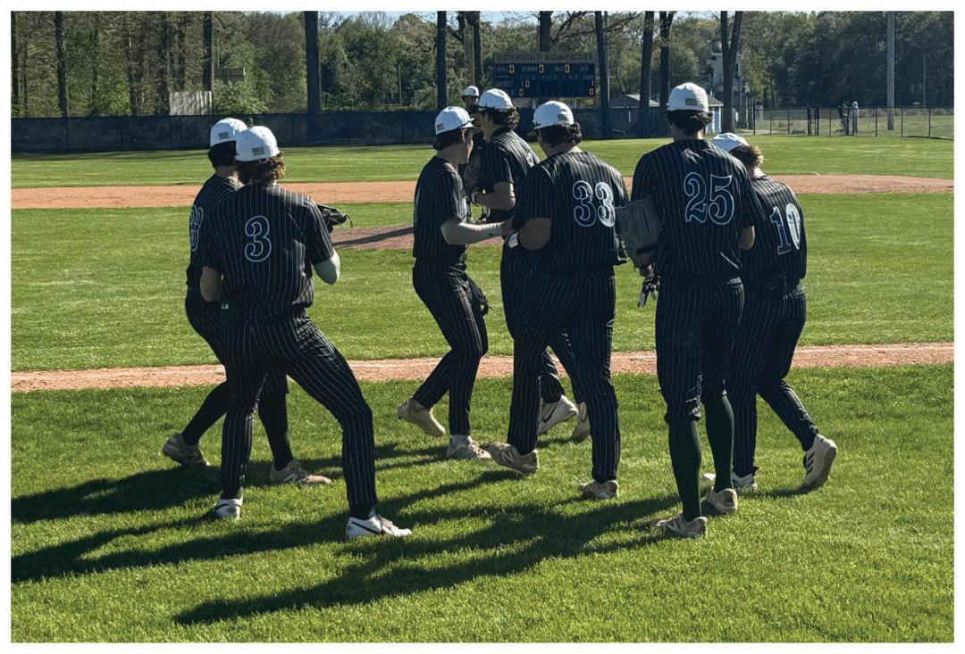 A group of baseball players on a field. Description generated by AI