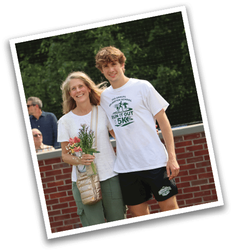 A man and a woman standing together, the woman holding a bouquet of flowers. Description generated by AI