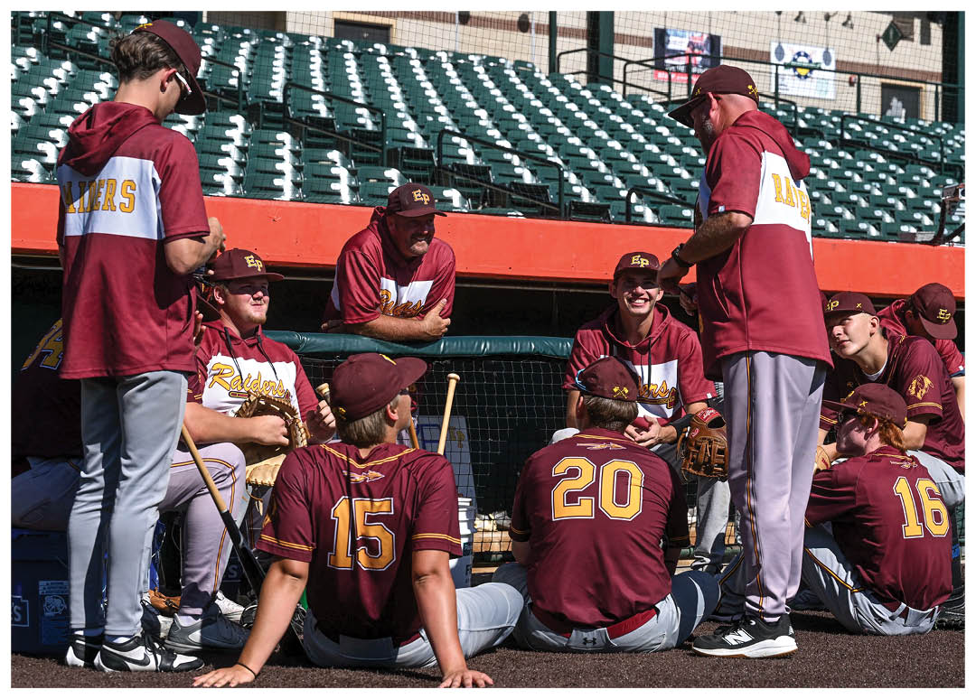 A group of football players on a field, one of them holding a football. AI generated content