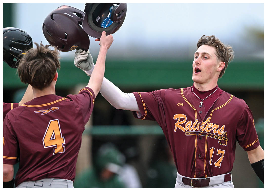 A group of football players on a field, one of them holding a football. AI generated content