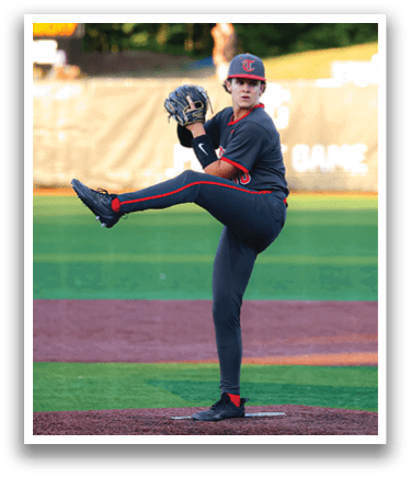 A baseball player in a gray uniform is on the pitcher's mound, getting ready to throw the ball. AI generated content