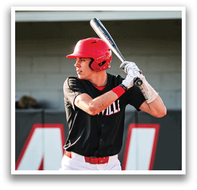 A baseball player in a black shirt and red helmet is holding a bat, ready to swing. AI generated content