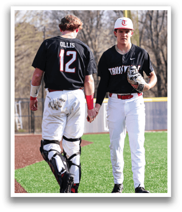 Two baseball players wearing black shirts and white pants are walking on the field. AI generated content