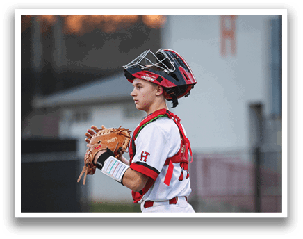 A young baseball player wearing a catcher's mitt and holding a bat. AI generated content
