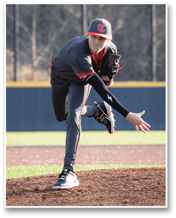 A baseball player in a grey uniform is pitching a ball on a field. AI generated content