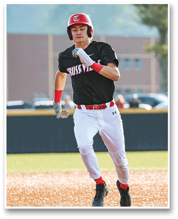 A baseball player wearing a red and black uniform is running on the field. AI generated content