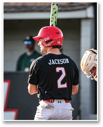 A baseball player wearing a red helmet and a black jersey with the number 2 on it. AI generated content