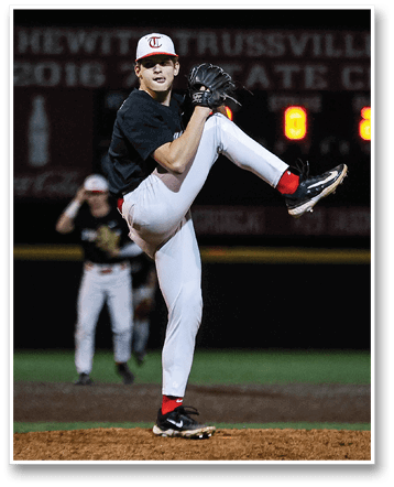A baseball player in a black shirt and red socks is in the process of throwing a ball. AI generated content