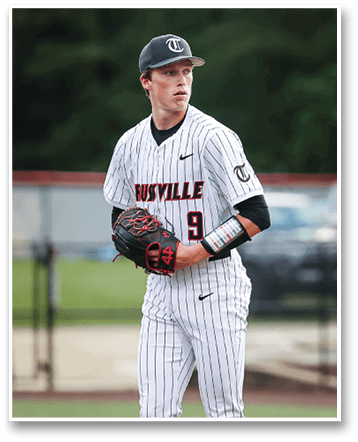 A baseball player wearing a black and white uniform stands on the field holding a glove. AI generated content
