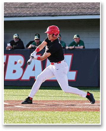 A baseball player in a black shirt and red hat is swinging a bat at a ball. AI generated content