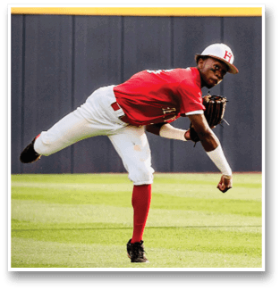 A baseball player in a red shirt and white pants is in the process of catching a ball. AI generated content