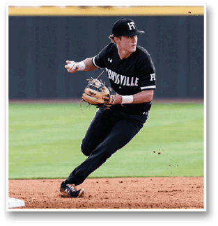 A baseball player in a black shirt and hat is running towards a base. AI generated content