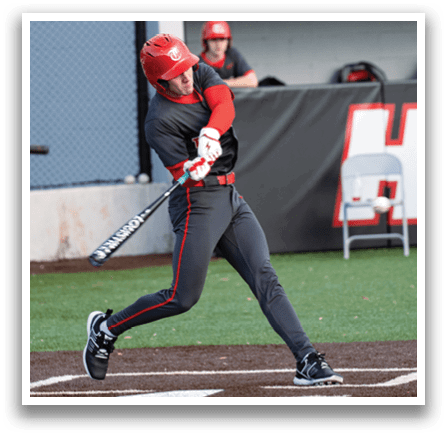 A baseball player in a grey uniform is swinging a bat at a ball. AI generated content
