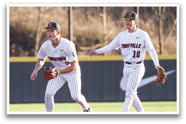 Two baseball players from the University of Tennessee are walking on the field. AI generated content