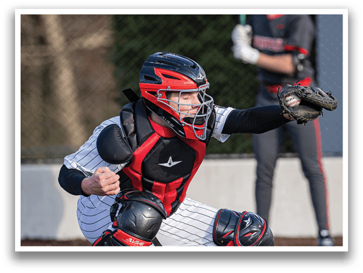 A baseball player in a catcher's position, wearing a helmet and protective gear, is ready to catch a ball. AI generated content