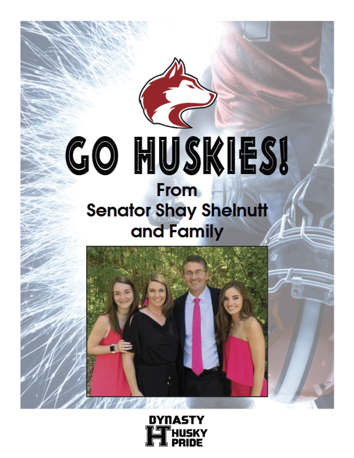 A family poses for a photo in front of a football game banner. AI generated content