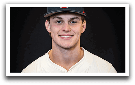 A man wearing a baseball uniform and a black hat with the letter T on it. AI generated content