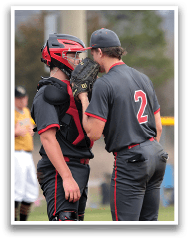Two baseball players wearing gray uniforms are talking to each other on the field. AI generated content