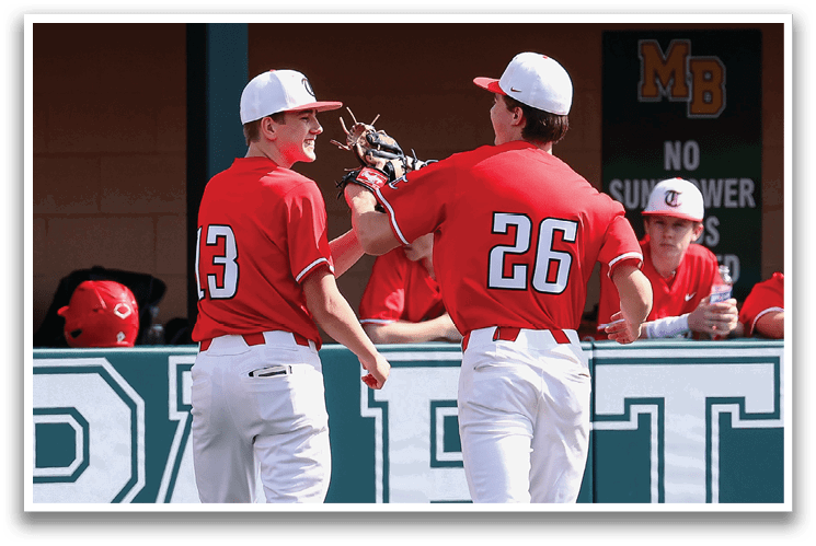 Two baseball players wearing red and white uniforms are shaking hands on the field. AI generated content
