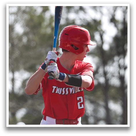 A baseball player in a red and white uniform is holding a bat, getting ready to swing. AI generated content