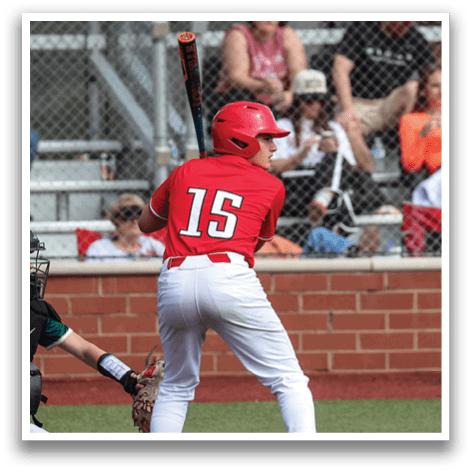 A baseball player in a red shirt and white pants is holding a bat and getting ready to swing. AI generated content