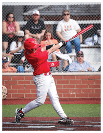 A baseball player in a red helmet and white uniform is swinging a bat at a ball. AI generated content