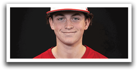 A young man wearing a red baseball jersey with the word “Trussville" on the front. AI generated content