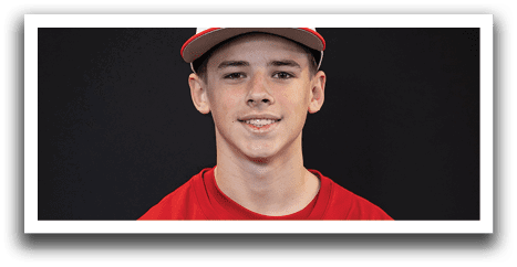 A young man wearing a red baseball jersey with the word “Trussville" on the front. AI generated content