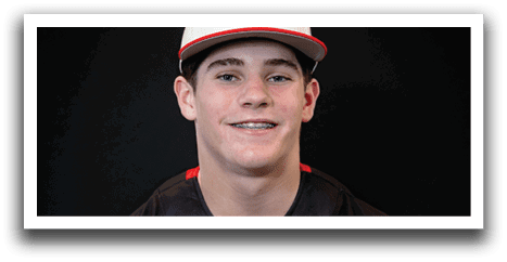 A young man wearing a black and red baseball jersey with the word “Huskies" on the front. AI generated content