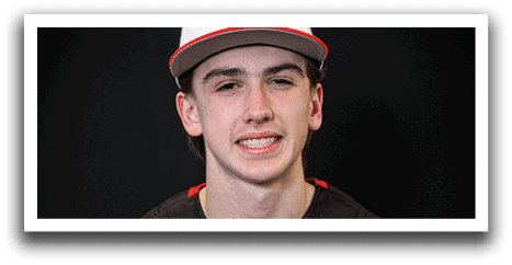 A young man wearing a baseball uniform and a black hat with a red T on it. AI generated content