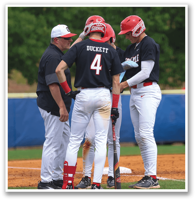 Three baseball players wearing red helmets and white uniforms are standing on the field. They are talking to each other and holding baseball bats. AI generated content