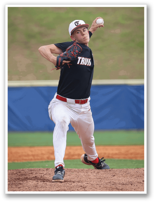 A baseball player in a black shirt and red shorts is throwing a ball. AI generated content
