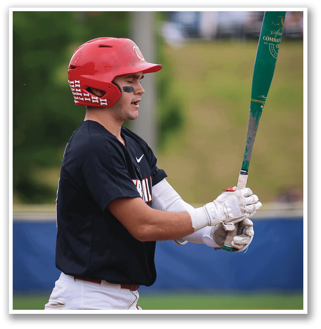 A baseball player in a red helmet and black shirt is holding a bat, preparing to swing. AI generated content