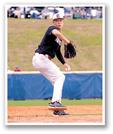 A baseball player in a black shirt and white pants is pitching a ball on a field. AI generated content