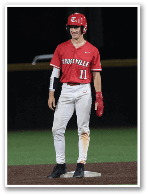 A baseball player wearing a red shirt and a helmet is standing on a field. AI generated content