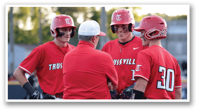 Three baseball players wearing red jerseys are talking to a coach. AI generated content