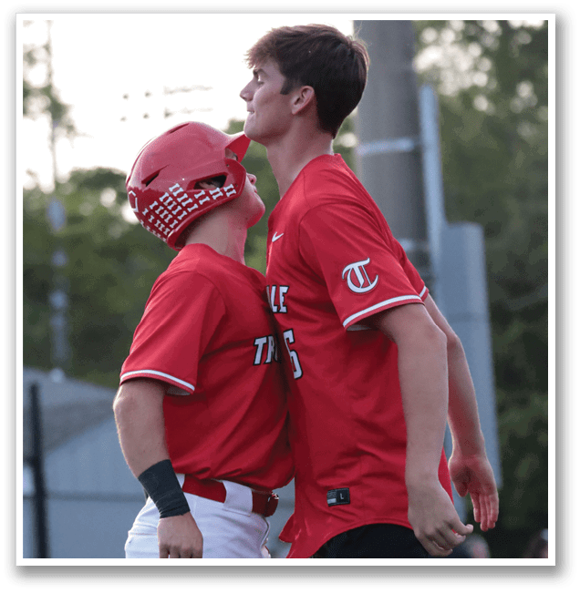 Two baseball players hugging each other in red and white uniforms. AI generated content