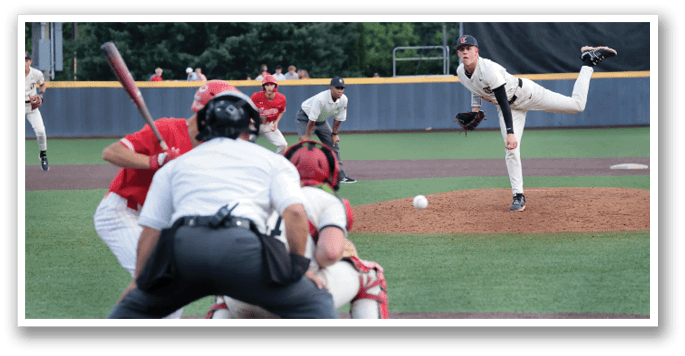 A baseball game is in progress with a pitcher throwing a ball to a batter. There are several players on the field, including a catcher and an umpire. The pitcher is in the middle of his throw, while the batter is ready to swing. The scene captures the excitement and anticipation of the game. AI generated content