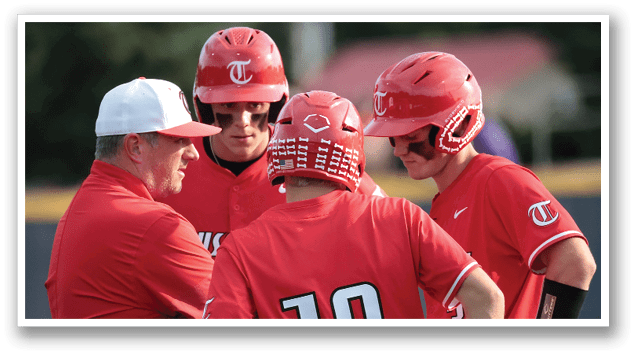 Three baseball players wearing red helmets and red jerseys are talking to a coach. AI generated content