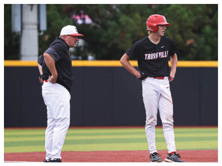 Two men are standing on a baseball field, one wearing a red helmet. AI generated content