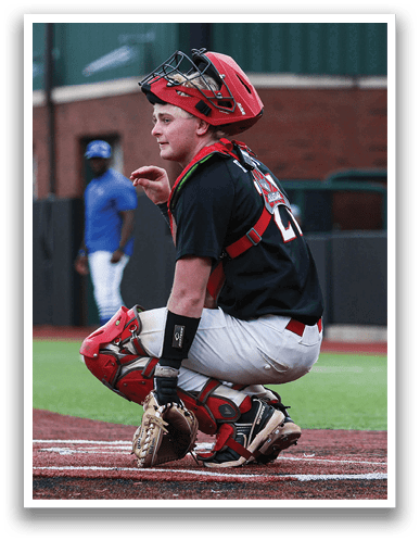 A baseball player wearing a catcher's mitt is squatting on the field. AI generated content