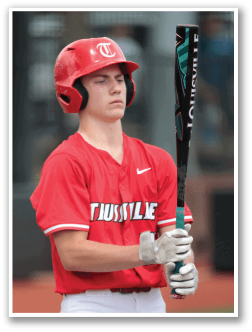 A baseball player wearing a red shirt and a helmet is holding a bat. AI generated content